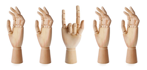 Difference, uniqueness, individuality. Wooden human hand models and one showing rock gesture on white background