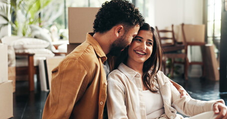 Boxes, mortgage and property with couple in living room of new home together for growth or investment. Hug, love or smile with happy man and woman in apartment for bonding, milestone or real estate