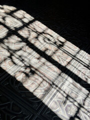 shadow of window grate on the floor