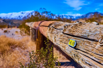 Rustic Fence and Snow-Capped Mountains in Motion Perspective