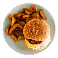 Delicious cheeseburger with beef patty and cheese on a plate, with french fries. Isolated over white background