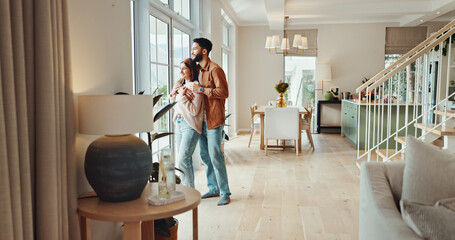 Smile, couple and relax with embrace at house for love, partner trust and bonding together in lounge. Happy, people and hug with loyalty, relationship romance and morning view for marriage commitment