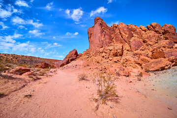 Desert Rock Formations and Hiker in Moapa Valley Midday Perspective