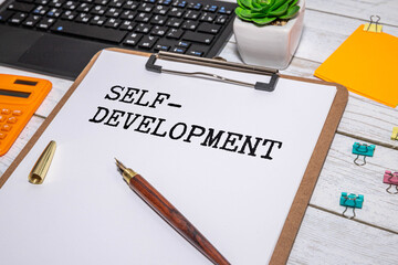 There is a paper sticking out of a jeans pocket with the inscription - Develop Self Awareness