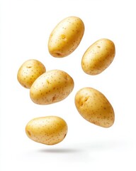 Obraz premium Falling Potatoes - Fresh and Ready to Cook