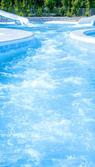 Lazy river pool with gentle currents and slides