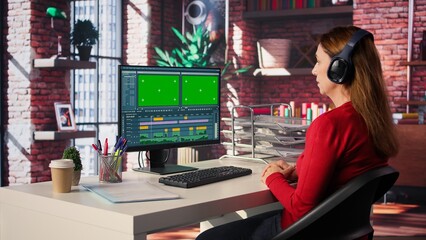 Female video creator working on editing a movie with green screen, using a movie post production software. Female footage editor starting the cinematic film editing industry. Camera B.