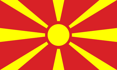 Flag of North Macedonia displaying vibrant red and yellow colors with sun rays radiating outward