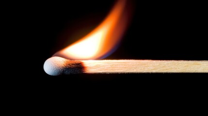 Lit Matchstick Close up Against Black Background