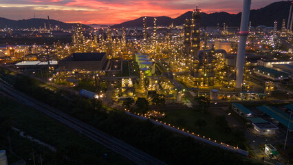 Oil Refinery plant at sunset. Gas Chemical Equipment Prodiction import export Concept, Crude Oil Refinery Plant Steel Pump Pipe line and Chimney and Cooling tower, Chemical Petrochemical