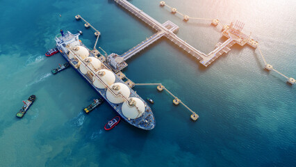 LNG (Liquified Natural Gas) tanker anchored in Gas terminal gas tanks for storage. Oil Crude Gas...