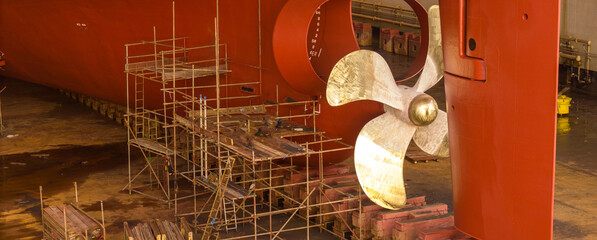 Propeller of large ship spinning power working and water splash contrail . Close up image detail Stern back of Vessel ship, Logistics Transportation industry express technology Freight.. © Yellow Boat