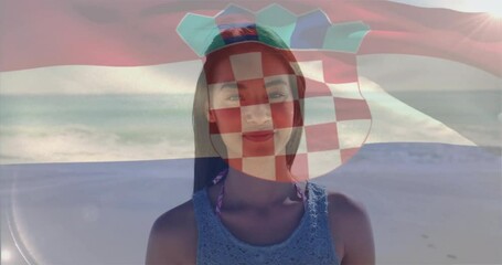 At beach, woman with Croatian flag animation overlay on her face - Powered by Adobe