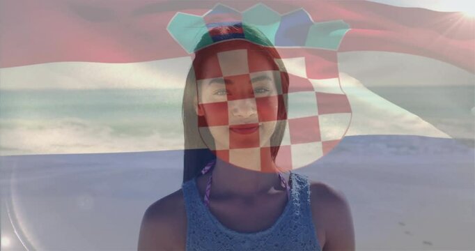 At beach, woman with Croatian flag animation overlay on her face - Powered by Adobe