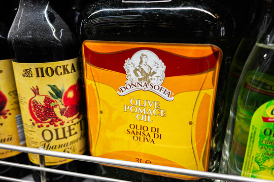 Donna Sofia olive pomace oil bottle displayed on a grocery shelf