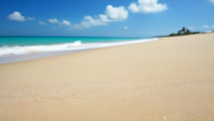 Serene Sandy Beach with Clear Turquoise Waves Under Blue Sky