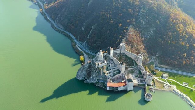 Embark on a mesmerizing aerial tour around Golubac Fortress. Witness dramatic rocky formations and the mighty Danube as the camera captures the stunning interplay of nature and history.