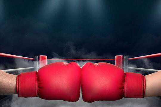 Boxers fighting surrounded by smoke in boxing ring, closeup - Powered by Adobe