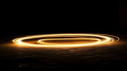 Glowing orange light tracing a circular path in darkness