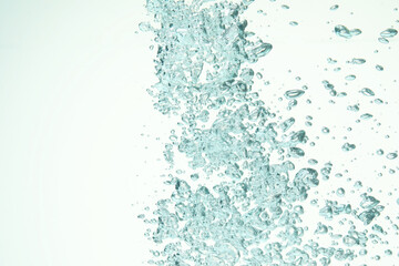 Many water bubbles on light background, closeup