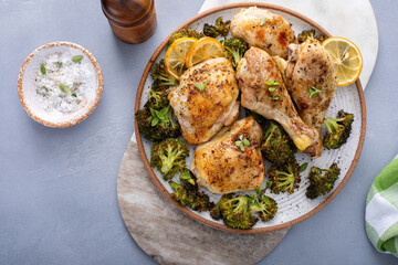 Oven roasted chicken with broccoli on a serving plate, easy sheet pan dinner or lunch idea