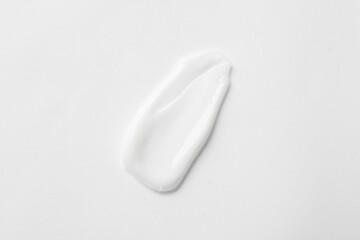 Sample of body cream isolated on white, top view