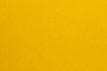 A yellow background with a white line, textured origami paper backdrop