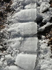 Chunks of melting snow and ice