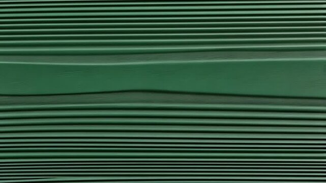 Textured green surface with parallel lines created by paint application technique