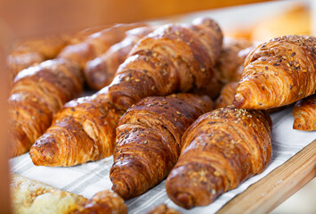 Showcase of traditional Spanish bakery shop with appetizing croissants
