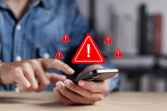 Ransomware malware attack and data breach. Person use smartphone with system hacked warning sign. Spam virus with warning caution for notification on internet security protect.
