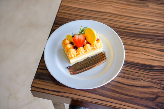 Elegant Dessert with Fruit and Chocolate Garnish