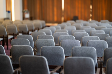Empty Conference Hall with Rows of Chairs