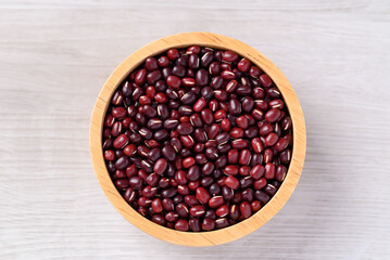 Azuki beans or red mung beans in wooden bowl on white background, Food ingredient, Top view