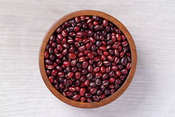 Azuki beans or red mung beans in wooden bowl on white background, Food ingredient, Top view