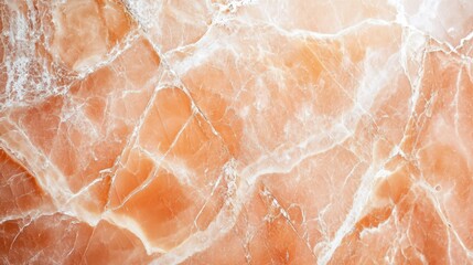 A detailed macro shot of pink marble with intricate white veins and shine.