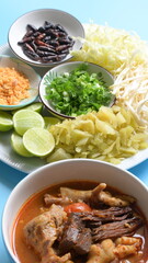 rice vermicelli with northern thai curry sauce on blue background