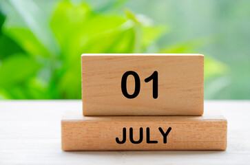 July 1st calendar text on wooden blocks with customizable space for text. Calendar concept