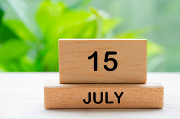 July 15th calendar text on wooden blocks with customizable space for text. Calendar concept.