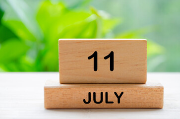 July 11th calendar text on wooden blocks with customizable space for text. Calendar concept.