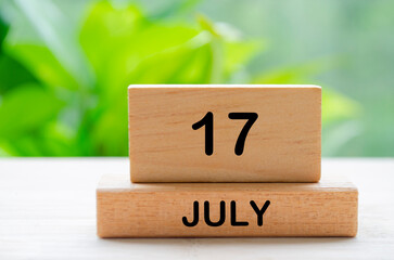 July 17th calendar text on wooden blocks with customizable space for text. Calendar concept.