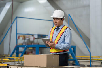 Male engineer, Industry factory, Storage warehouse. Asian male plant engineer working with digital tablet control or check operation of production system at industry factory