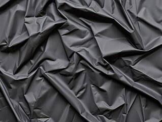 Overhead abstract image of textured black fabric a contrast in artistic settings