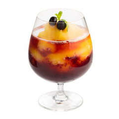 A glass of mango and berry smoothie topped with blueberries, isolated on a transparent background.