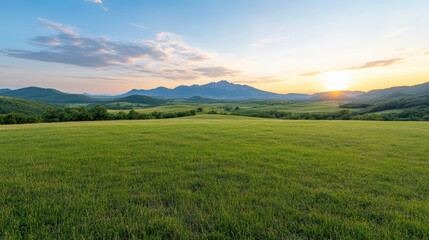serene landscape featuring rolling green hills vibrant sunset, with mountains background