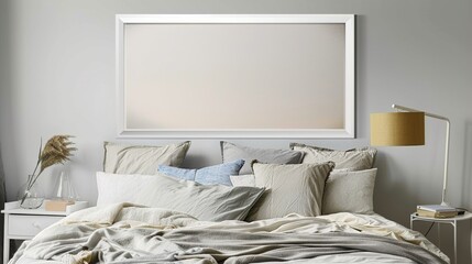 A white rectangular frame in a contemporary bedroom, placed above the bed with soft linens, pillows, and a lamp.   HD 8K mockup wallpaper Photographic Image