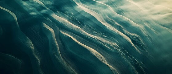 Captivating swirling underwater waves in shades of green and blue create a mesmerizing serene abstract natural scene full of movement and depth