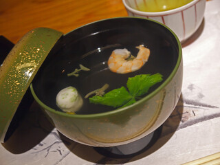 Japanese Ebi-Shinjo clear soup with shrimp and surimi ball in lacquered bowl