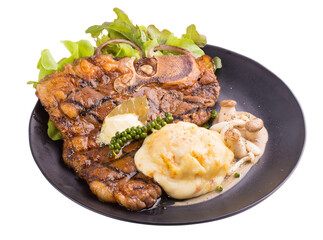 T-Bone Beef Steak In black plate.  Beef Steak Dinner. isolated on transparent background
