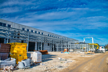 Early Construction Phase with Workers and Equipment on Site